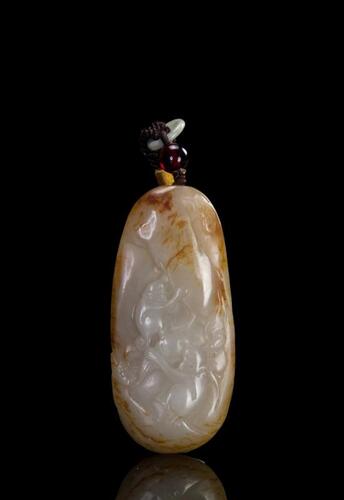 A White Jade Carved Monkey And Peach