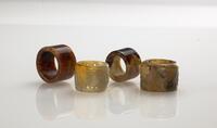 Qing-A Group Of Four Agate Archers Rings