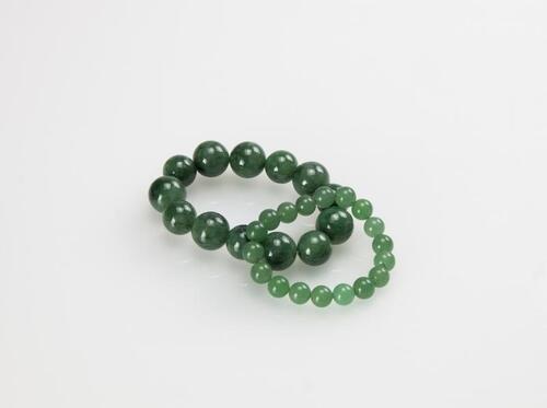 A Group of Two Jade Bracelets