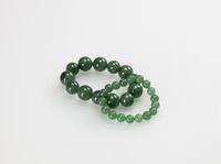 A Group of Two Jade Bracelets