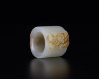 Qing - A Russet White Jade Carved Monkey Archers Ring