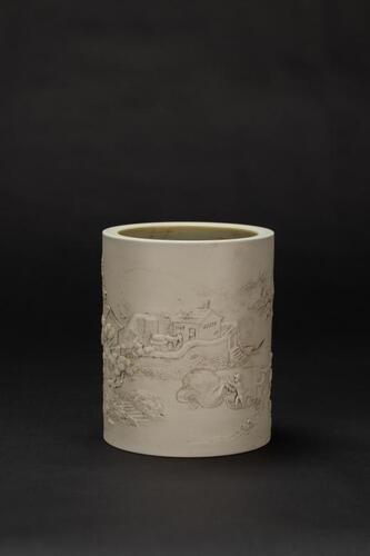 A Porcelain Brush Holder Carved Land scape and Figures