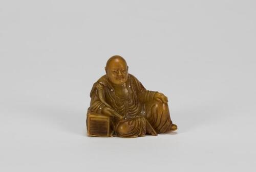 A Yellow Soapstone Carved Luohan