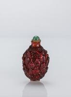 Qing-A Red Amber Carved ‘18 Luohan’ Snuff Bottle