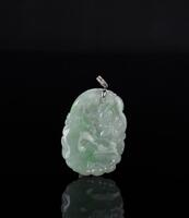 A Translucant Green Jadeite Carved Gold Fish in Lotus Pond Pendant