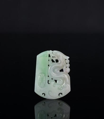 A Translucant Green Jadeite Carved Dragon And Shou’ Pendant