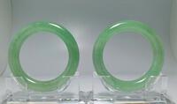 A pair of Spectacular translucent green Jadeite bangles