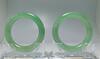 A pair of Spectacular translucent green Jadeite bangles