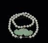 A Jadeite Pendant and 50 Beads Necklace