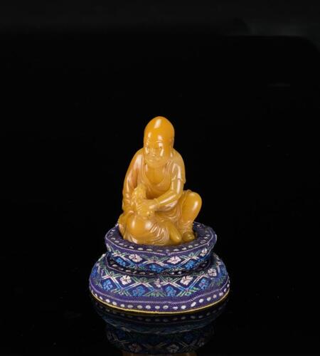 A Soapstone Carved Luohan with Stand
