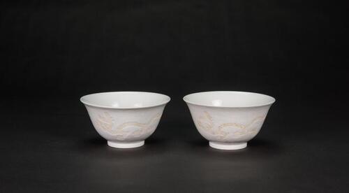 Late Qing- A Pair Of White Glaze Carved �Wave and Two Dragon� Bowls�