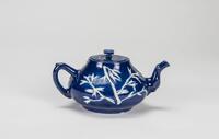 Qing - A Blue Ground Carved 'Plum Flower' Tea Pot