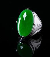 A Translucent Beautiful Green Jadeite Ring Mount In 18K Gold And With Diamond