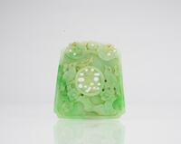 A Green Jadeite Carved Magpie and Shou Pendant