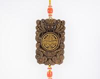 An Agalloch Wood Pendant Carved "Fu,Shou" with Inlaid Gold