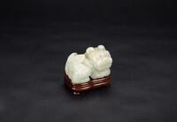 Late Qing - A White Jade Carved Lion (woodstand)