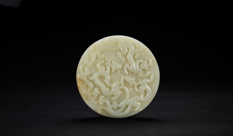 Qing - A White Jade Carved ‘Chilong’ Bi