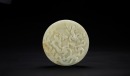 Qing - A White Jade Carved ‘Chilong’ Bi