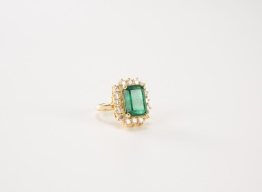 A 18K Gold 8.30 Carats Emerald & Diamond Ring.