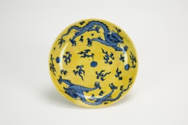 Qing - A Yellow Ground Glazed Blue And White ‘Double Dragon’ Dish