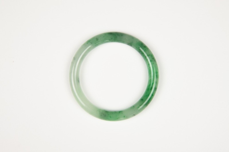 A Semi-Translucent Green Jadeite Bangle