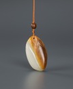 Qing-A Russet White Jade Carved ‘Melon’ Pendant - 2