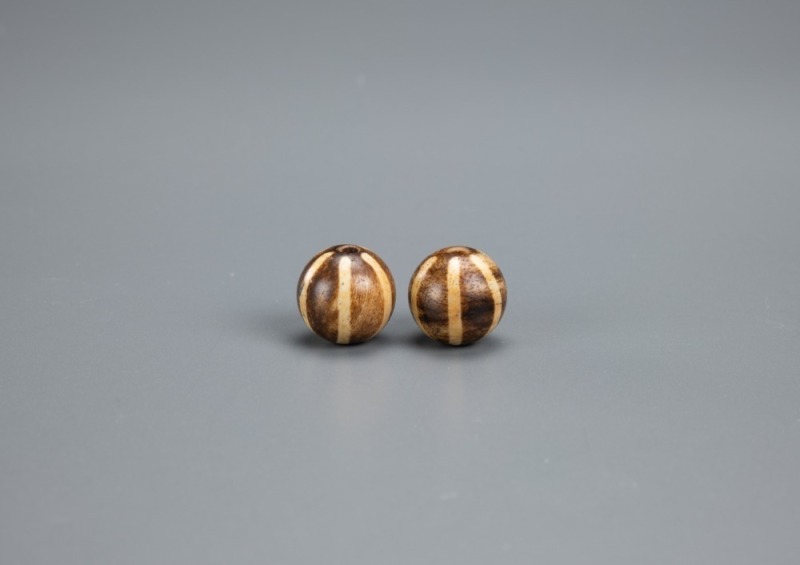 A Pair Of Pumtek Round Beads