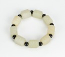 A Chinese White Jade Carved Nine Small Cong Shape Bracelet - 2