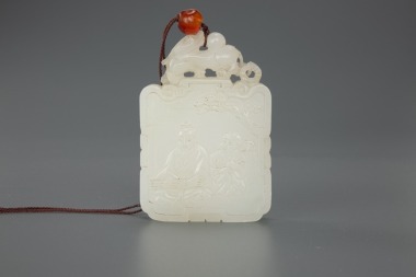 A Chinese White Jade Carved ‘Scholar Qin’ Pendant (Qing Dynasty)