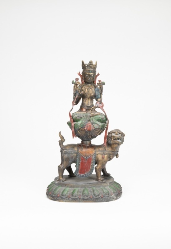 A Chinese Bronze Figure Of Manjusri Bodhisattva And Lion