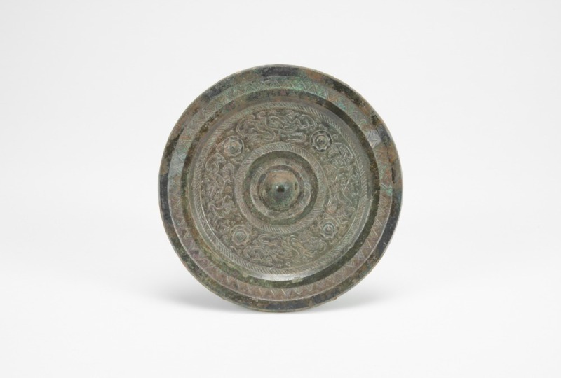 A Chinese Bronze Mirror With Four Dragon (Han Dynasty)