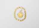 A 0.25 0z Panda Gold Coin Pendant And 24k Gold Bracelet