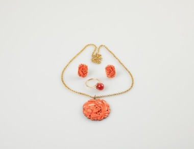 A Coral Pendant And Gold Chain,