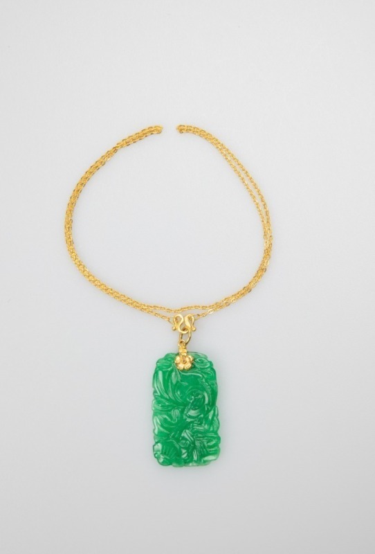 A 24k Gold Necklace And Jade Pendant