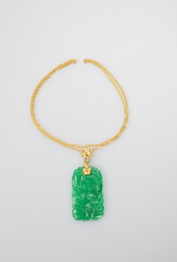 A 24k Gold Necklace And Jade Pendant