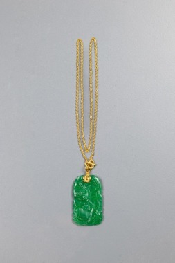 A 24k Gold Necklace with Green Carved Glass Pendant