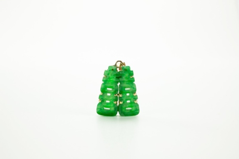 A Semi-Translucant Green Jadeite 'Double Happiness' Pendent