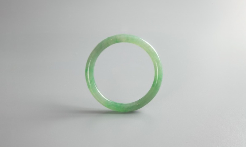 A Semi-Translucent Green Jadeite Bangle