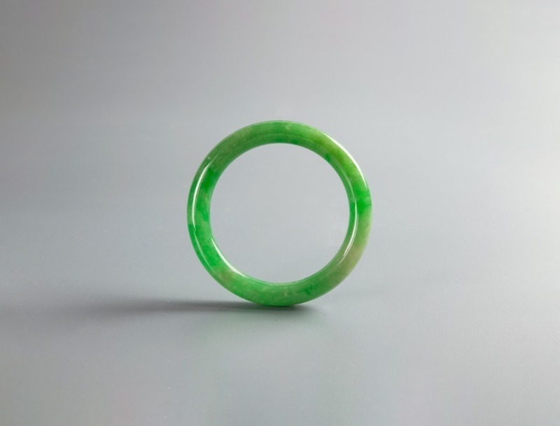 A Semi-Translucent Green Jadeite Bangle