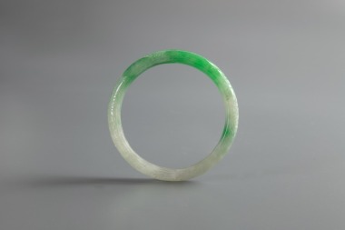 A Semi-Translucent Green Jadeite Bangle