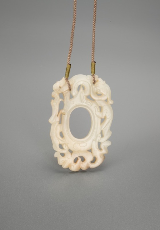 A Chinese White Jade Carved Chilung Pendant.