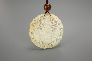 A Chinese White Jade Carved &lsquo;Child Ride Qilin&rsquo; Pendant.