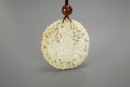 A Chinese White Jade Carved &lsquo;Child Ride Qilin&rsquo; Pendant.