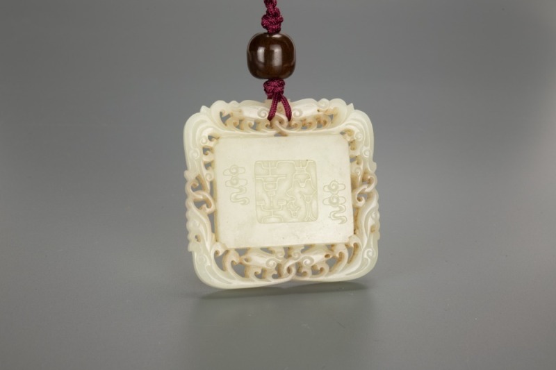A Chinese White Jade Pendant Carved &lsquo;Shou,Deer&rsquo;.