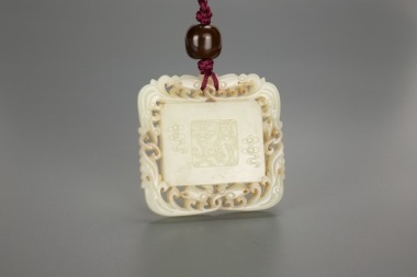 A Chinese White Jade Pendant Carved &lsquo;Shou,Deer&rsquo;.