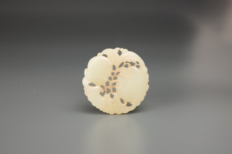 A Chinese White Jade Carved &lsquo;Peaches And Bat&rsquo; Pendant.
