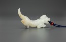 A White Jade Carved Tiger Pendant