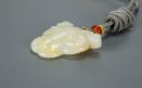 A Chinese White Jade Carved Leopard Face Pendant - 3