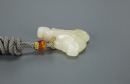 A Chinese White Jade Carved Leopard Face Pendant - 5
