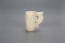 A Chinese White Jade Carved &lsquo;Beast&rsquo; Tube